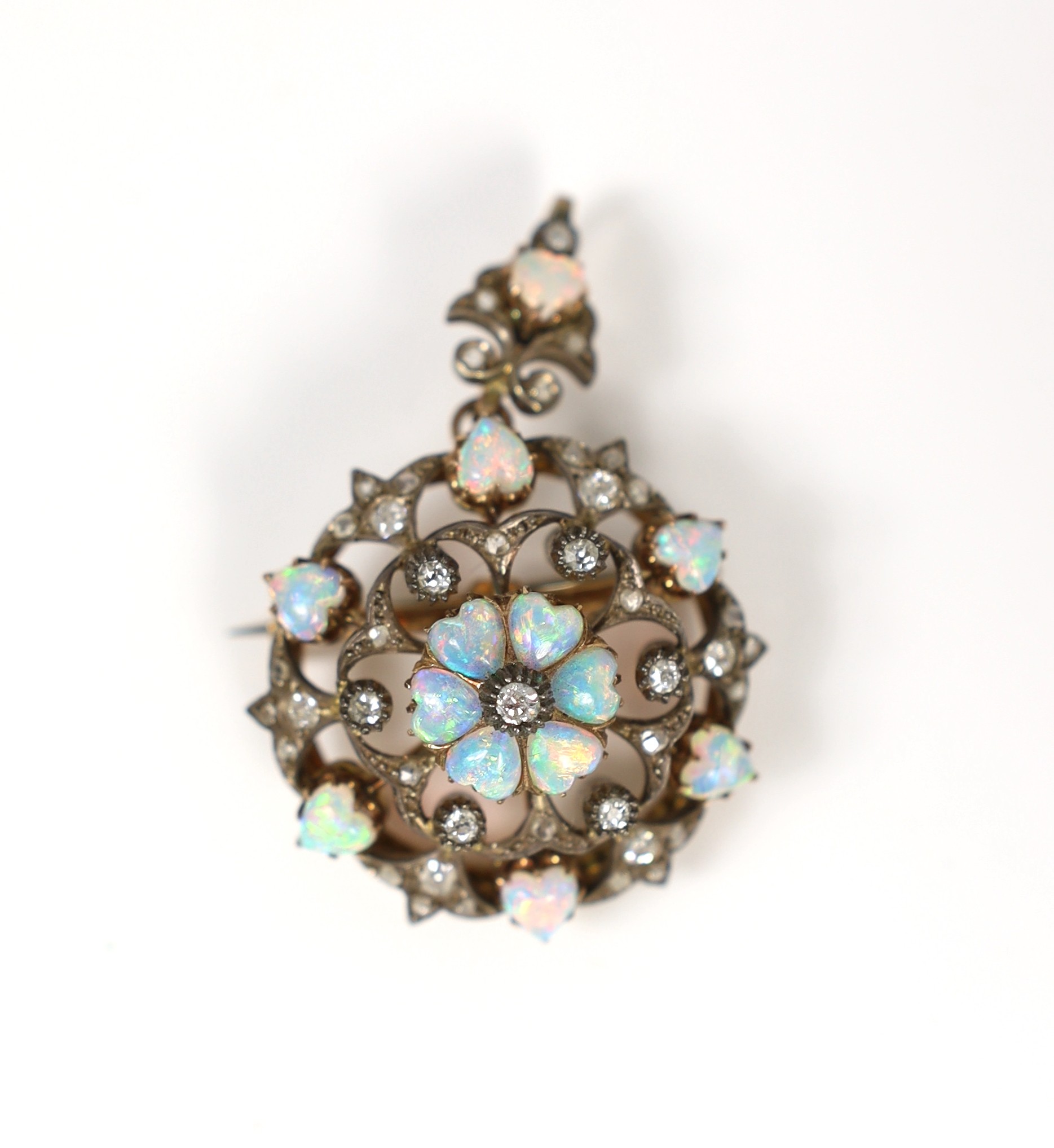 A Victorian gold and silver, heart shaped white opal and old round cut diamond cluster set circular drop pendant brooch